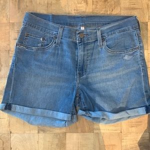 Levi’s denim shorts. Light wash, stretch, and small distressed detail.